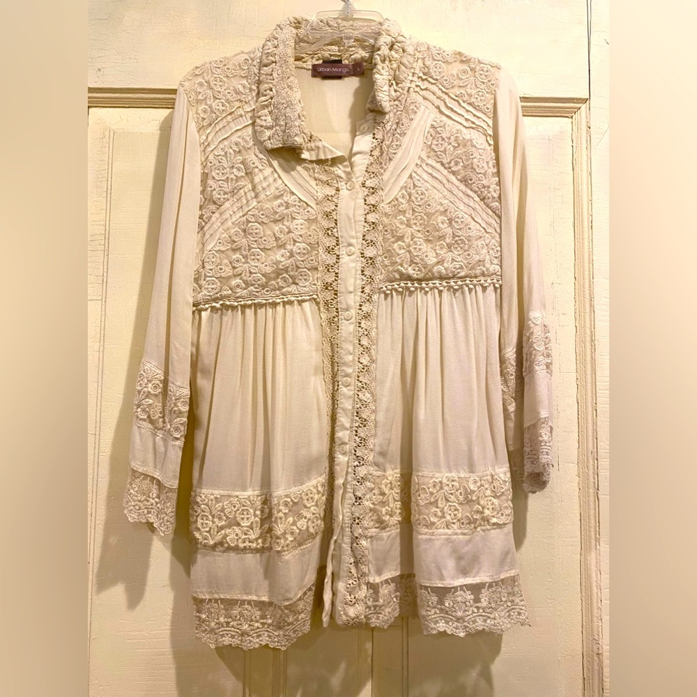Cream colored intricate lace embossed top